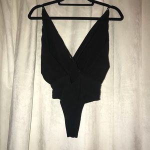 Size Small low cut cross back black bodysuit!